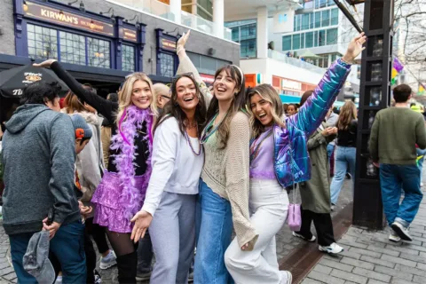 People celebrate Mardi Gras at The Wharf