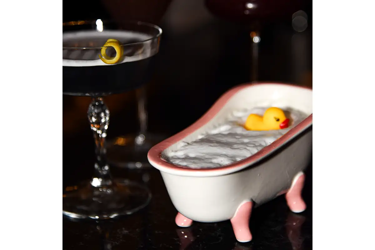Cocktail in a novelty bathtub glass
