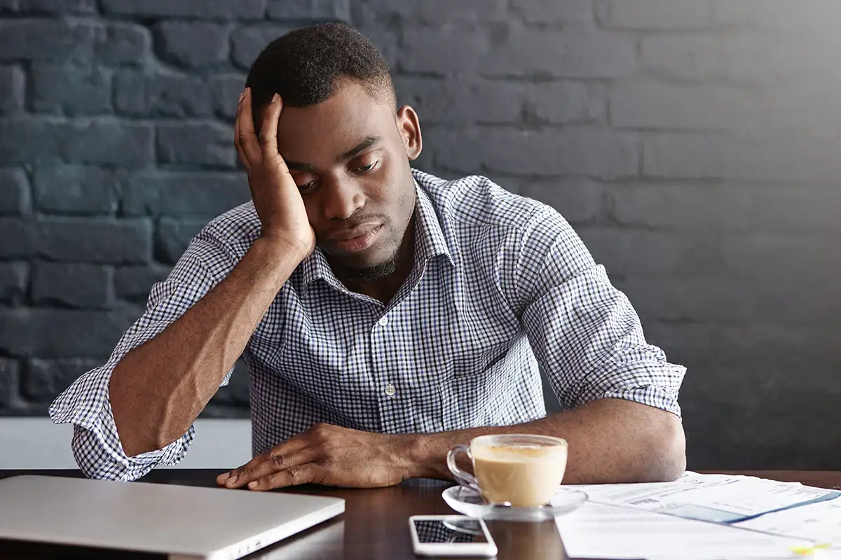 Man feeling tired at work