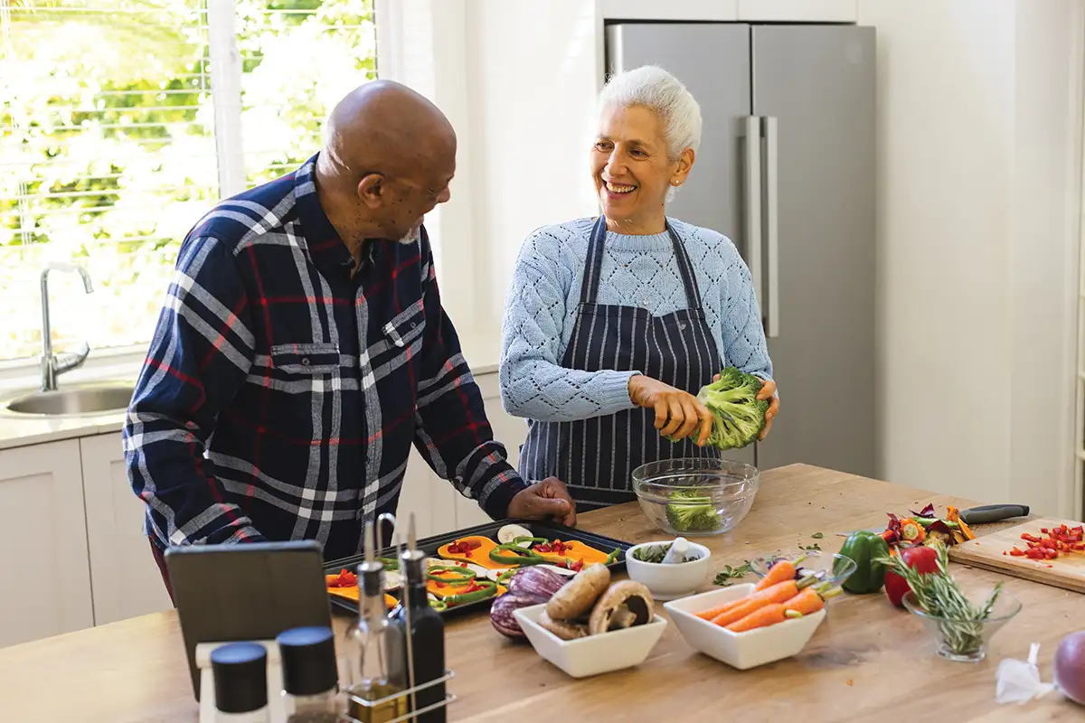 Older adults cooking dinner