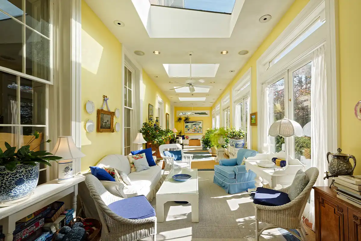 yellow sunroom with blue accents