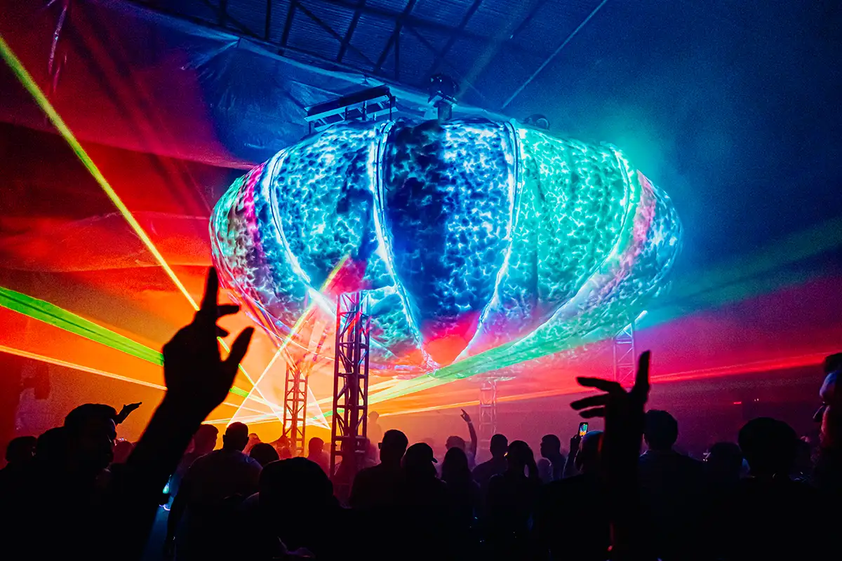 People dancing under the rainbow Fluffy Cloud at Enter Cloudfall party
