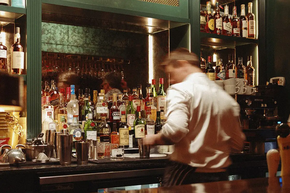 a bartender behind the bar at Hunter's Head Tavern