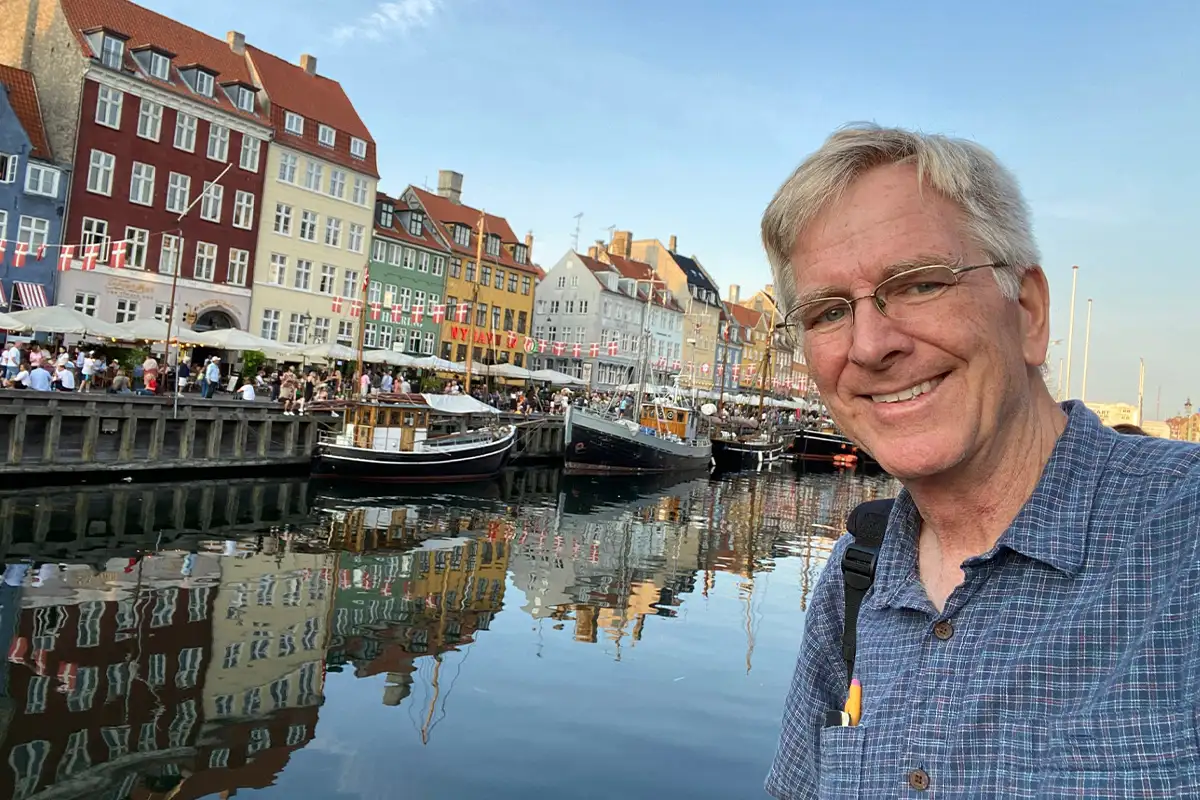 Rick Steves in front of a European canal