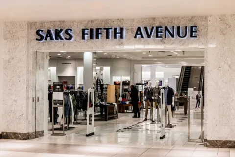 A Saks Fifth Avenue storefront in the interior of a mall