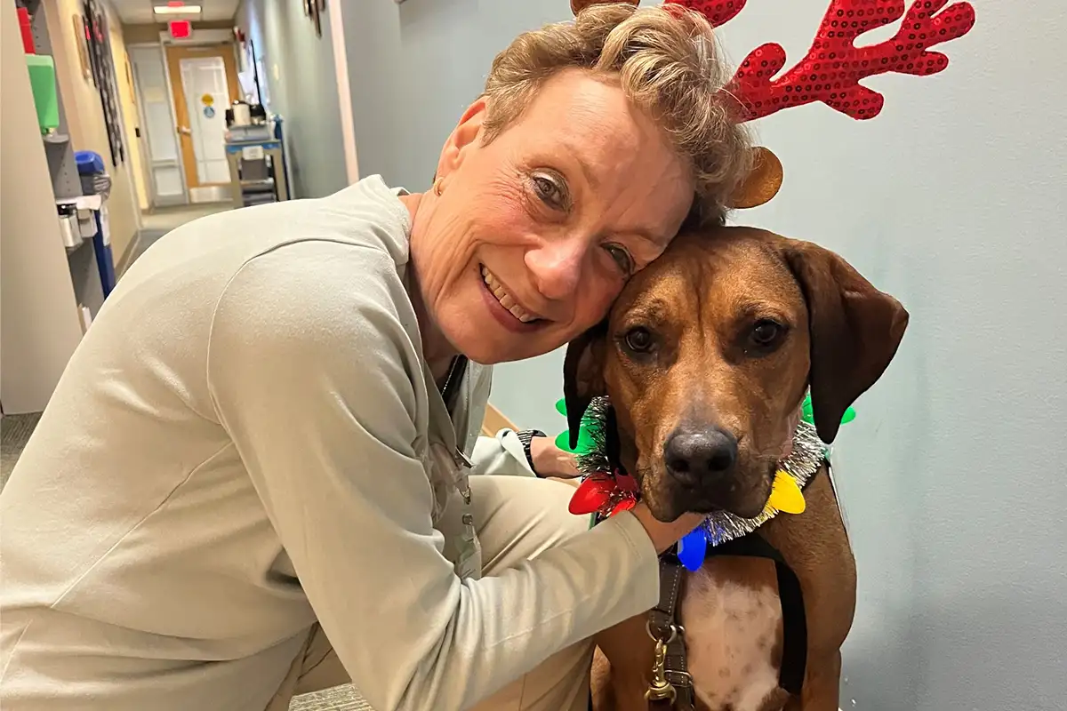 Sentara Northern Virginia Medical Center therapy dog posing with handler