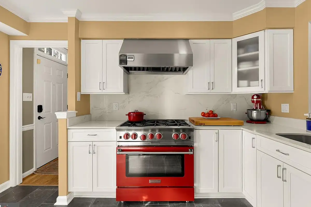 Kitchen with red gas range