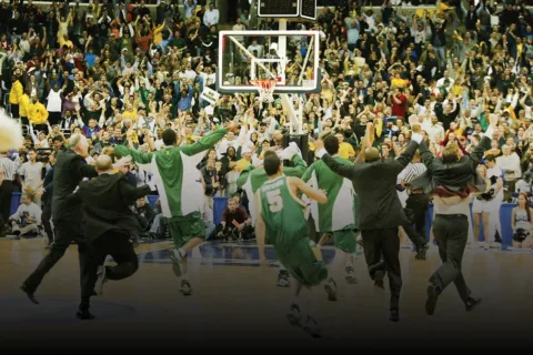 GMU celebrates after winning against UConn