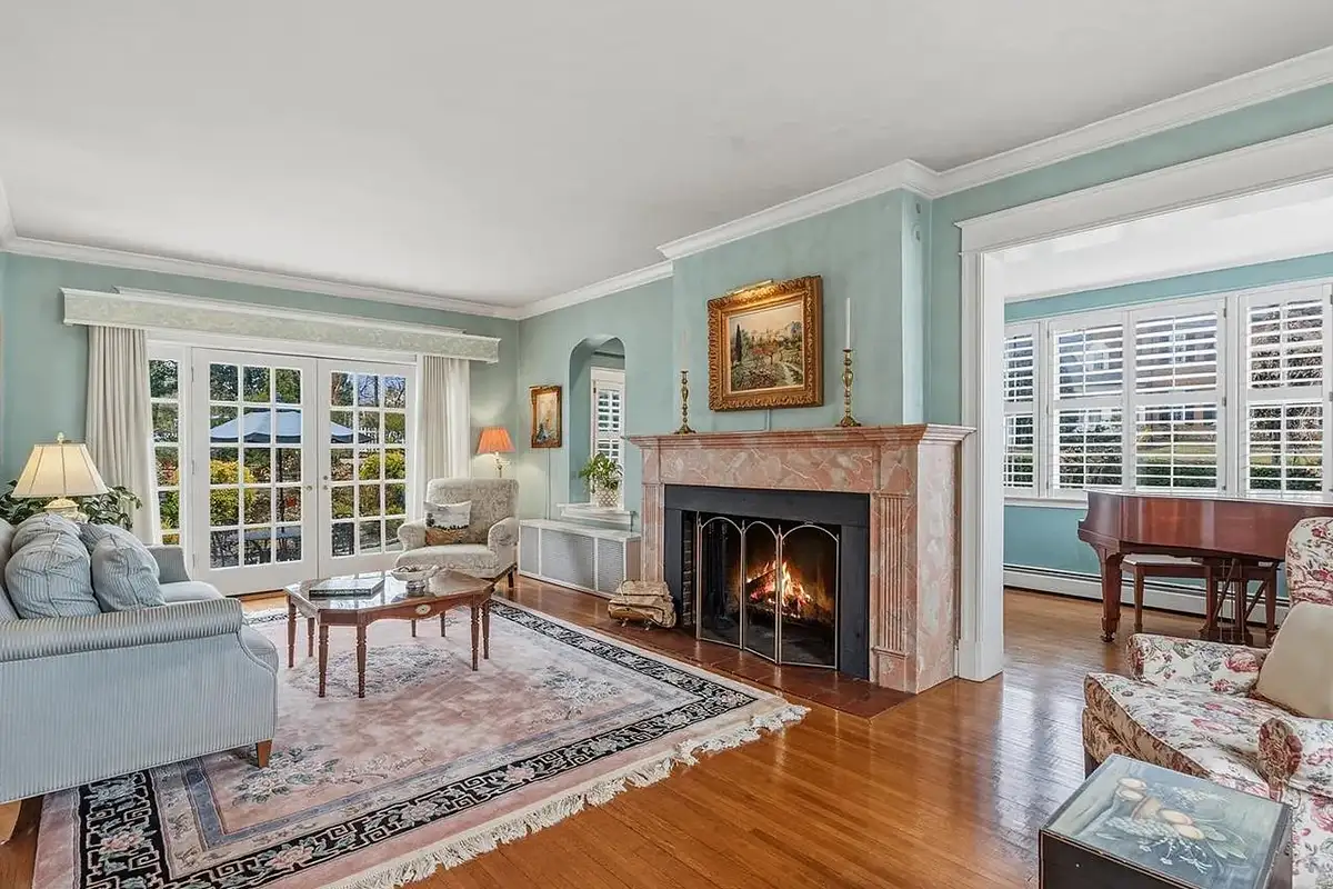 Living room with fireplace and French doors