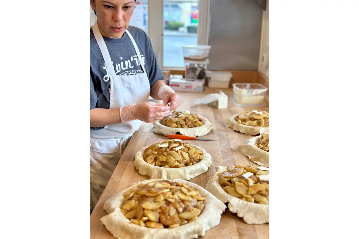 a worder prepares pies at Livin' the Pie Life