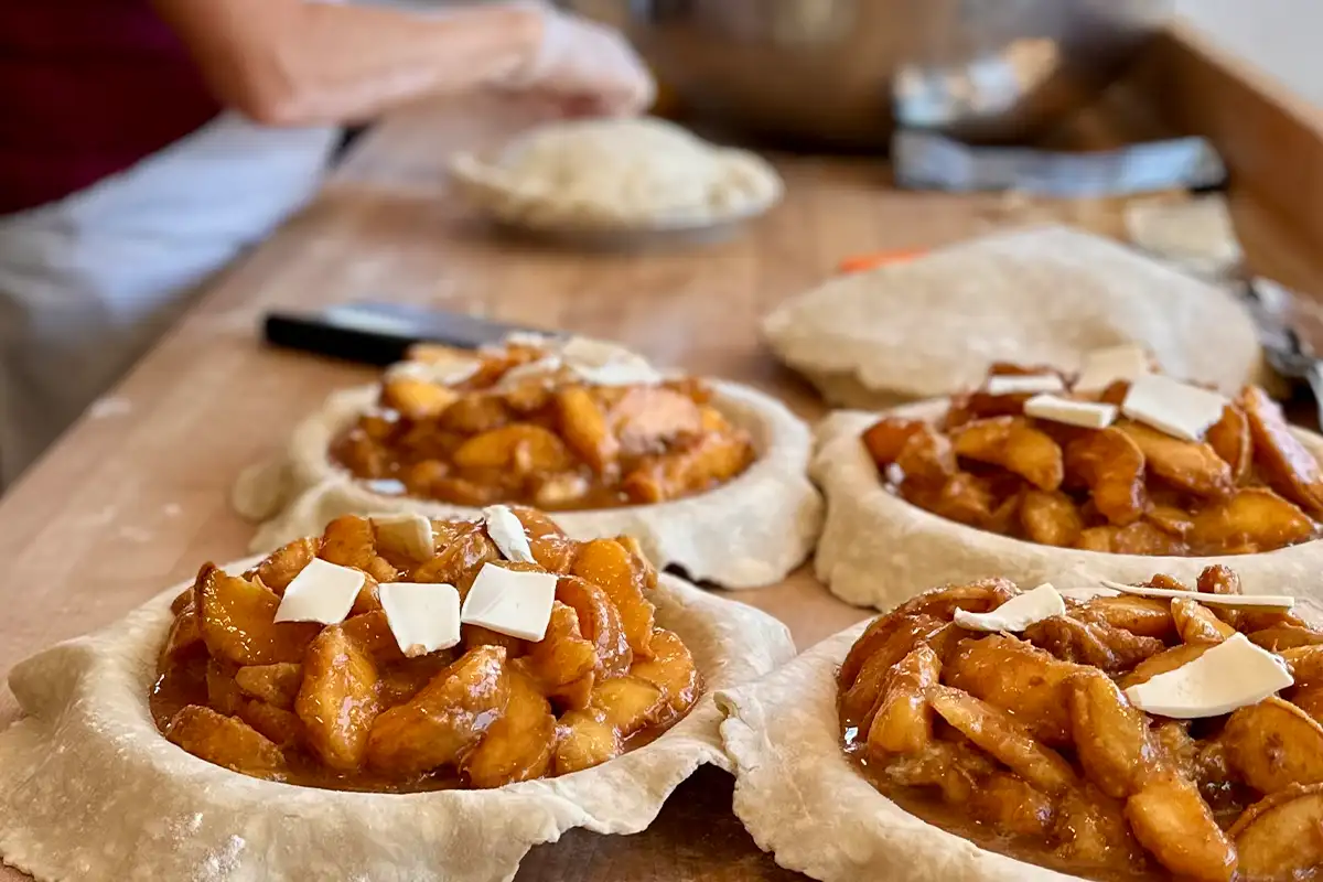 pre-cooked pies are prepared on a table