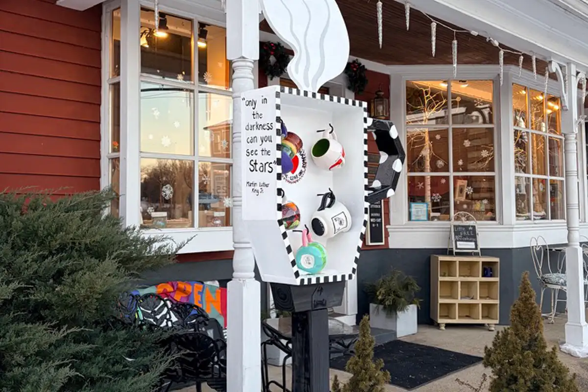 Mugs hang in a box at the mug exchange in front of Sophia Street Studios in Fredericksburg