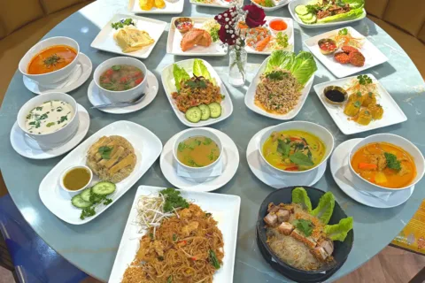 a table with multiple dishes from 246 Thai Street