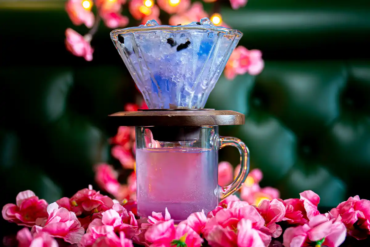 pouring over flowers cocktail