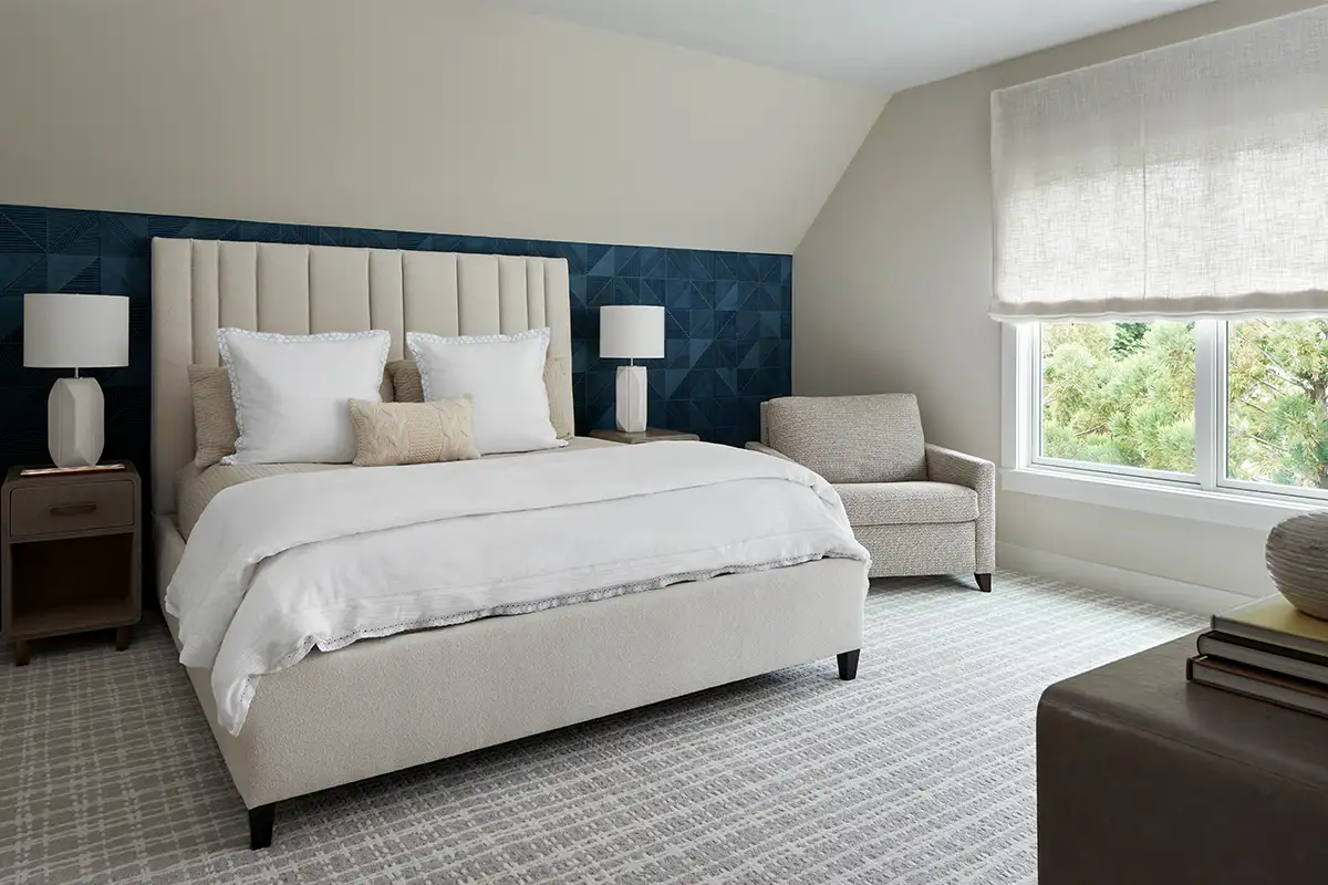 Blue wallpaper accent in bedroom