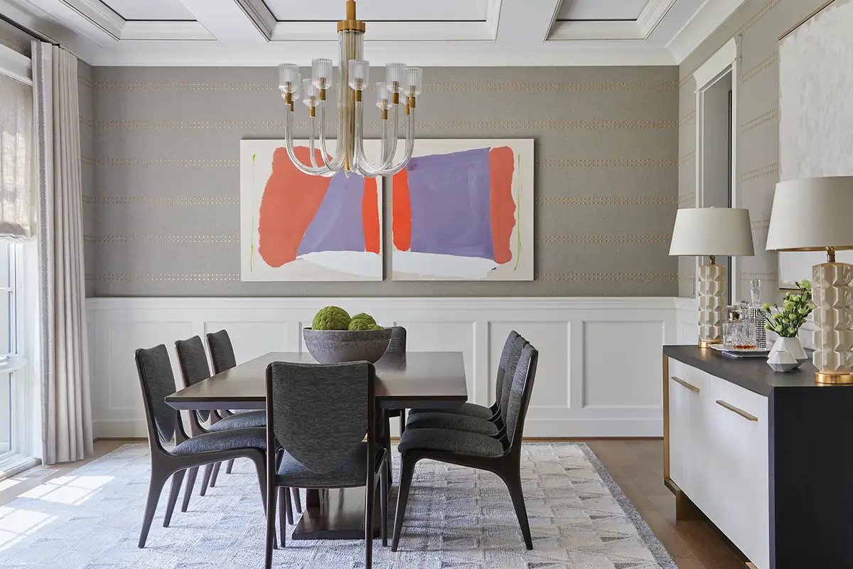 Textured wallpaper accent with colorful artwork in dining room