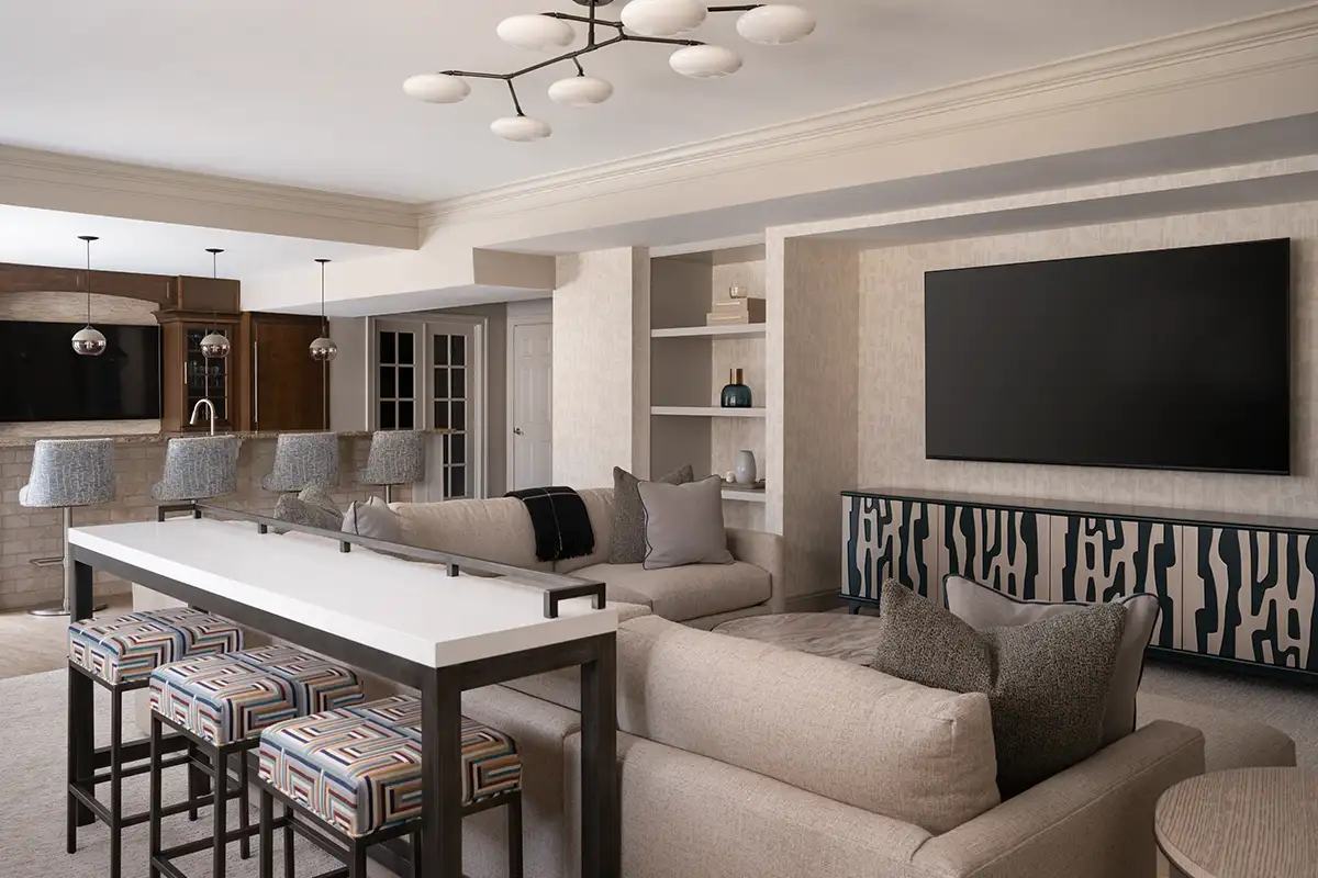Subtle patterned beige accent wallpaper in finished basement