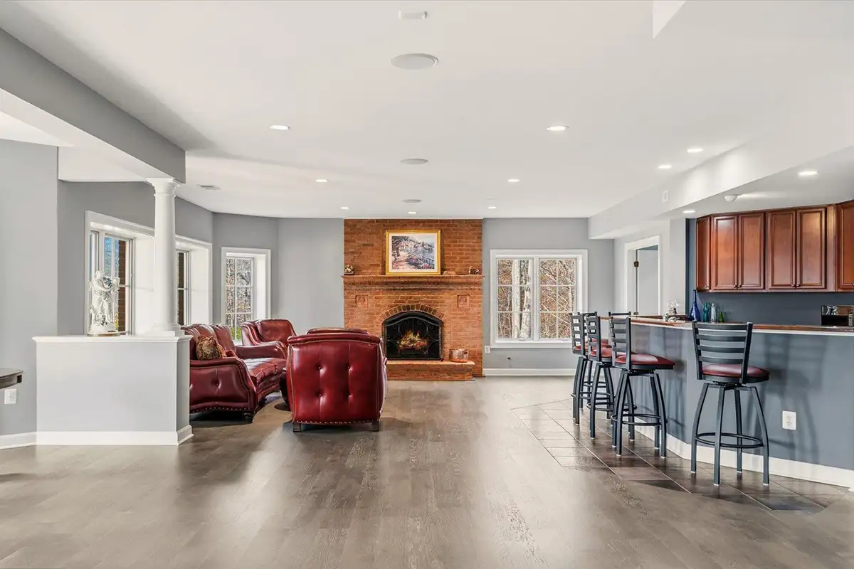 Recreation room with brick fireplace and wet bar of 10036 Lake Occoquan Dr