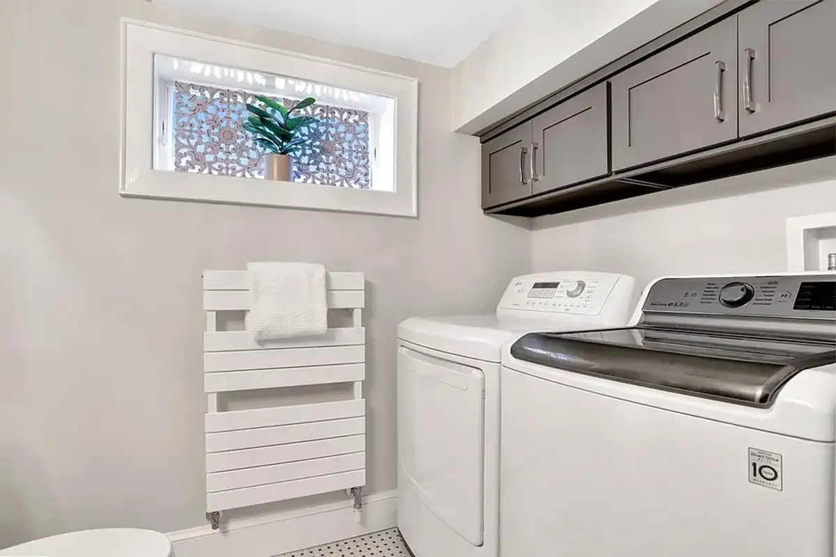 Half bathroom/laundry room of 102 West Mason Ave