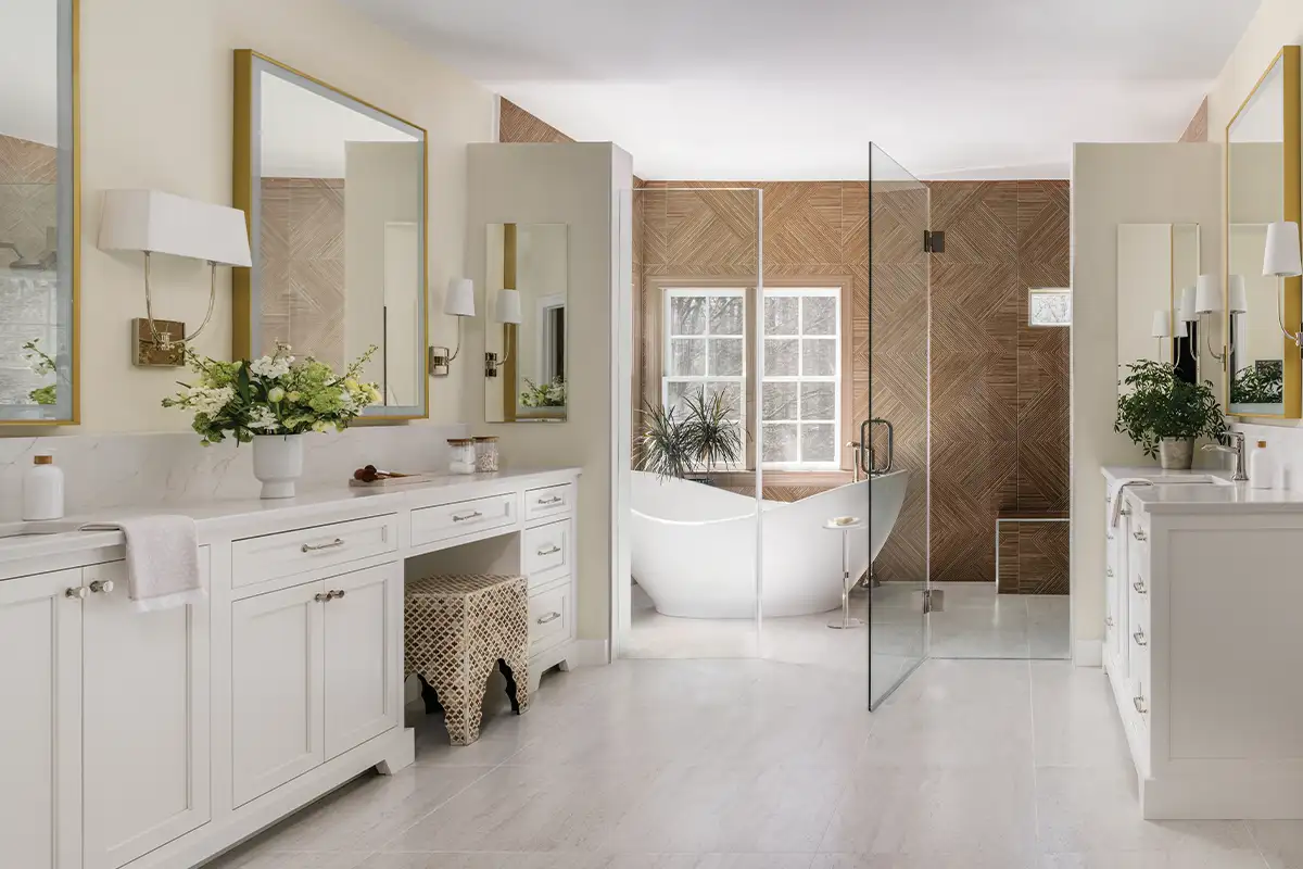 Minnesota Ash and Madagascar Biano from Porcelanosa Tile add texture and pattern to the wet shower’s feature wall and the flooring. Lighting sconces are from Visual Comfort.