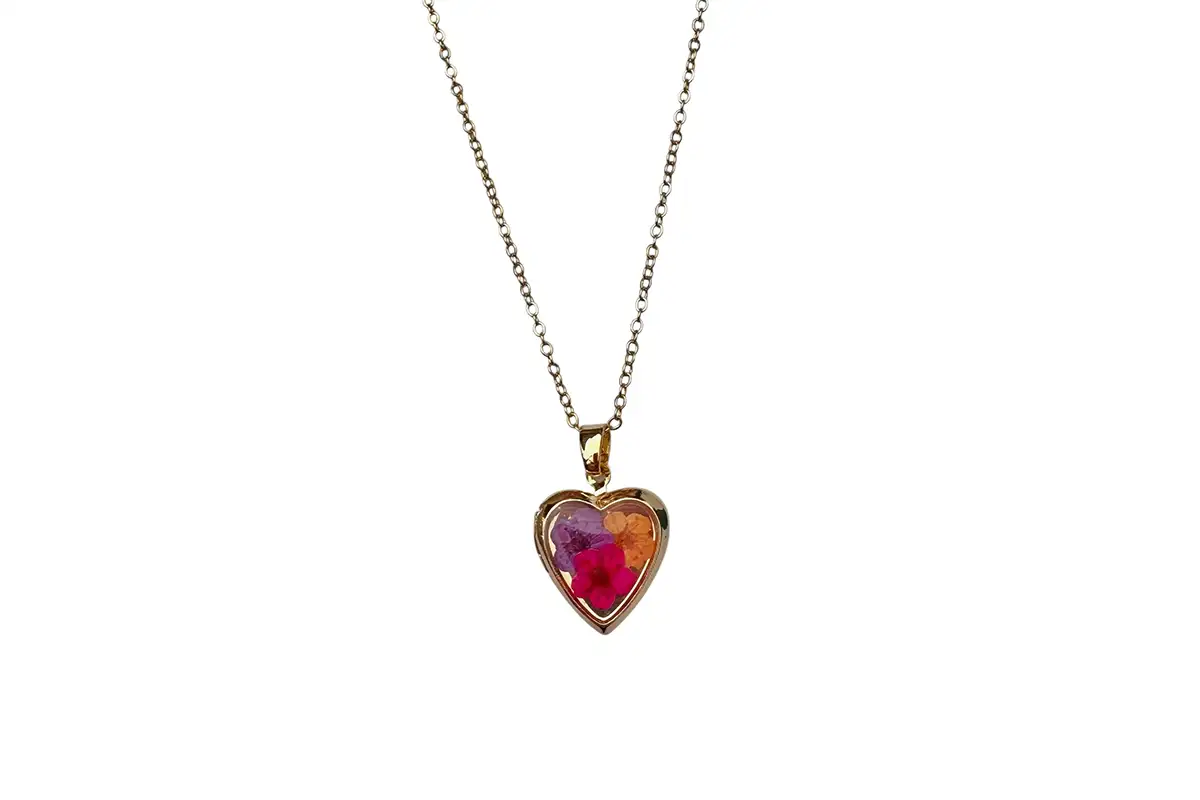 Heart-shaped locket with dried flowers