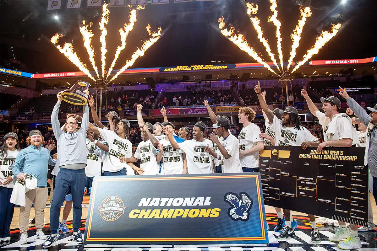 UMW men's basketball team players and coaches celebrate winning the D3 national championship