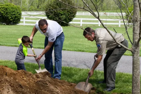 People shoveling dirt (Virginia State Parks Earth Day)