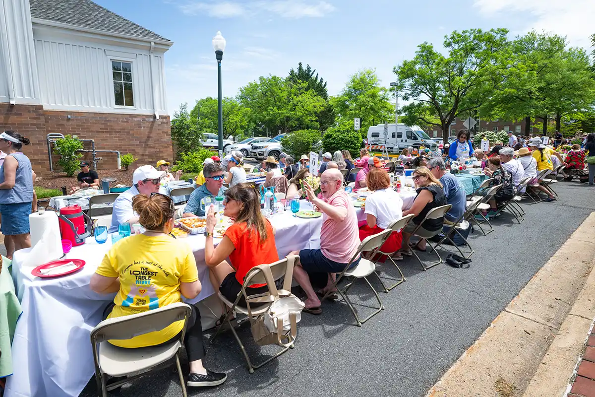 people sitting at tables and eating
