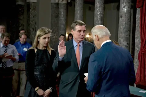 Madison Warner, left, and Mark Warner as he is sworn in by Joe Biden in 2015 (Mark Reinstein/MediaPunch)
