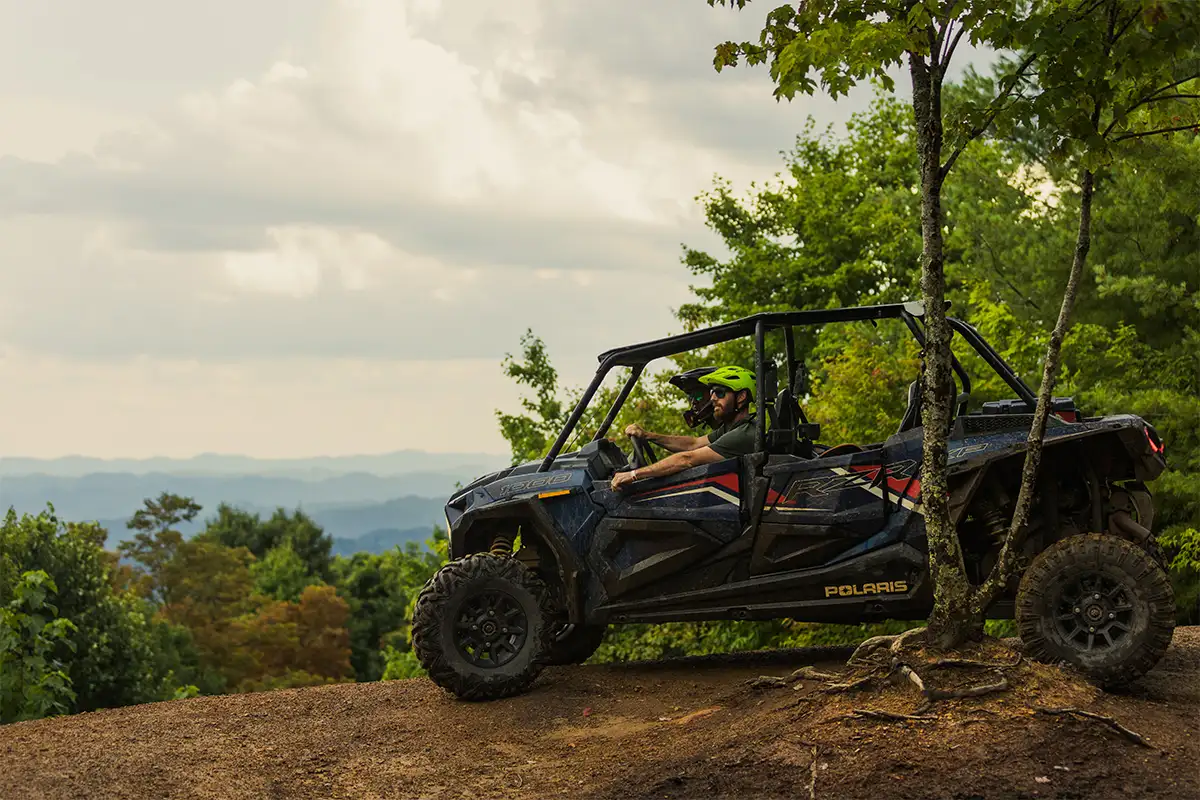 People in ATV at an overlook/clearing at Spearhead Trails VA