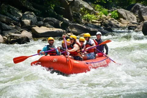 Group of people whitewater rafting with Wilderness Voyageurs on Pennsylvania's Youghiogheny River