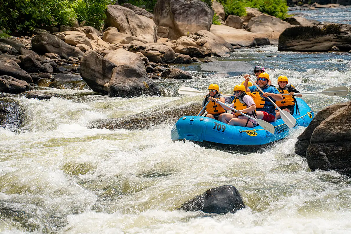 Group of people whitewater rafting with Ohiopyle Trading Post & River Tours on Pennsylvania's Youghiogheny River