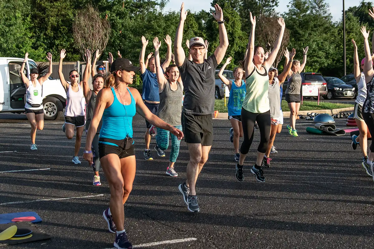 Group of people working out outdoors with INERGY Kelly's Bootcamp