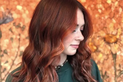 Woman posing styled red hair