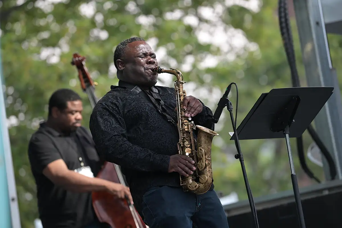 Man playing the saxophone at ALX Jazz Fest
