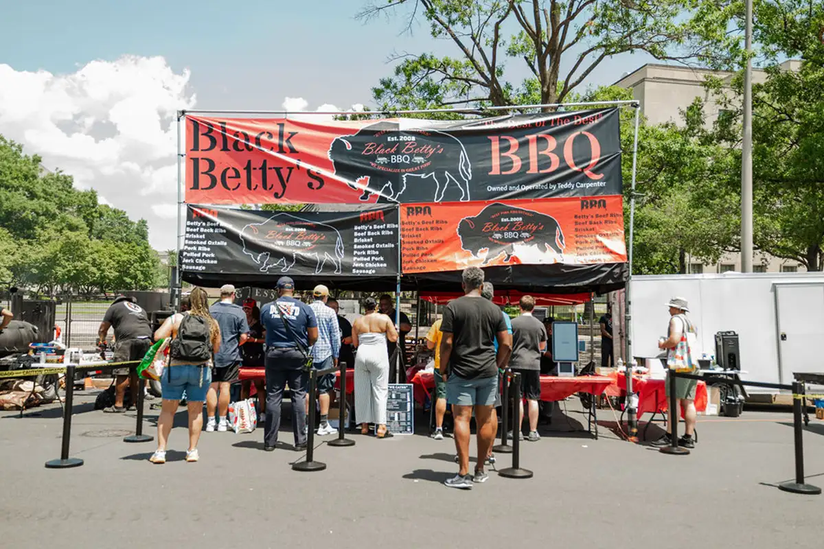 People on line to buy BBQ from a vendor at Annual BBQ Battle