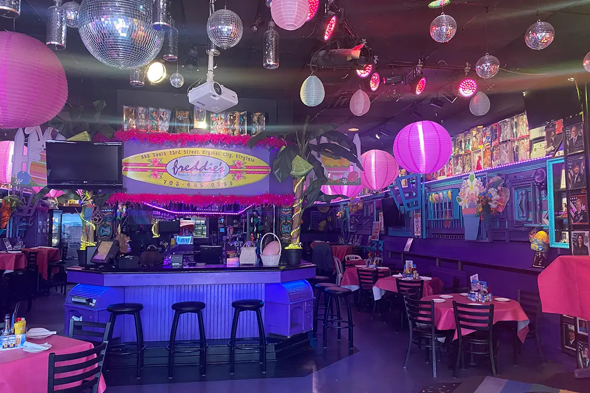 Interior of Freddie's Beach Bar with pink and tropical decor