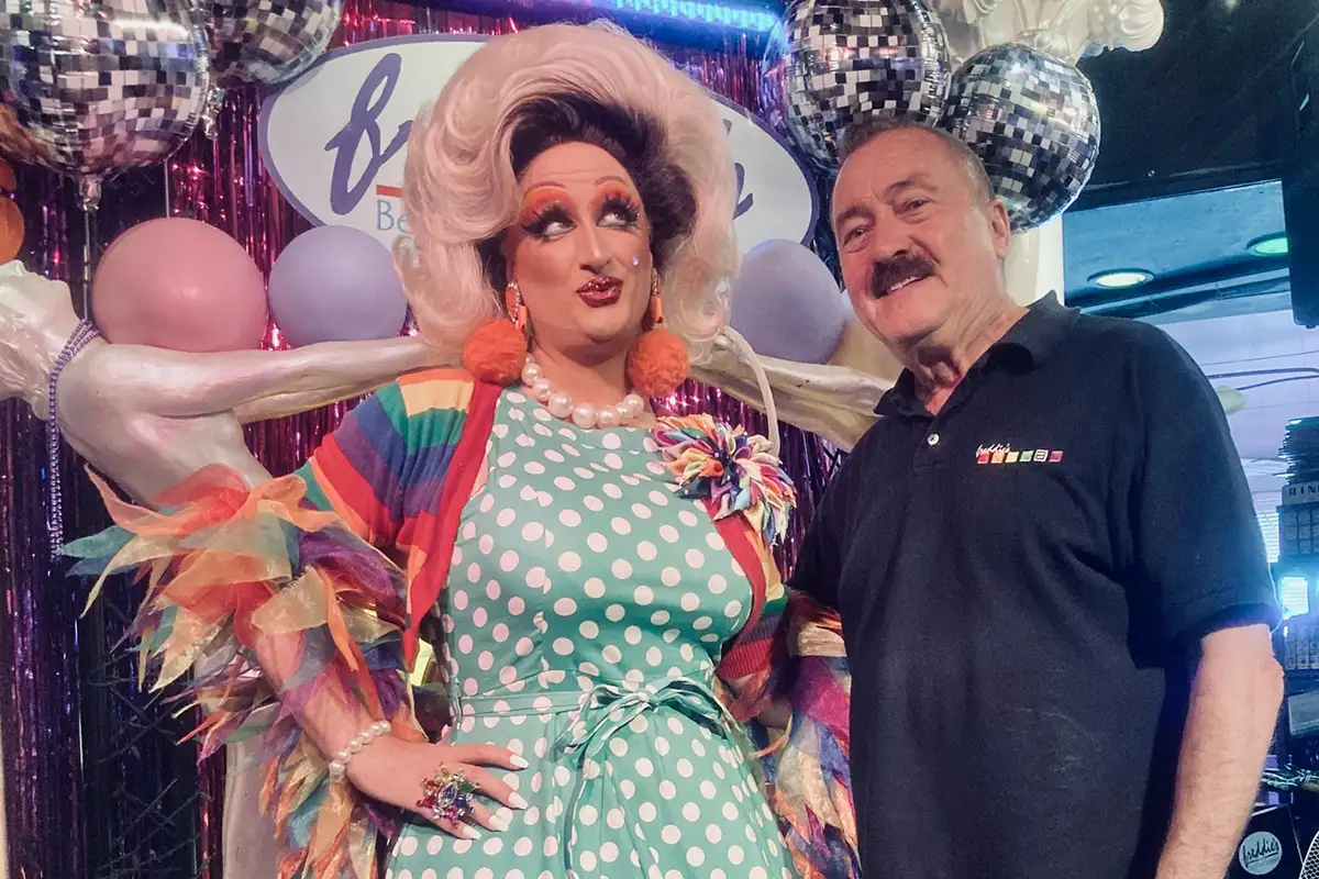Freddie Lutz posing with drag performer Tara Hoot
