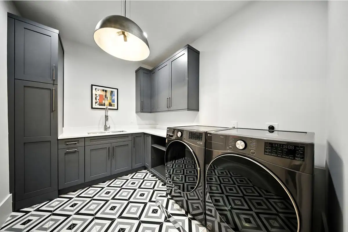 Laundry room with a sink and storage cabinets of 1200 Jossie Lane.