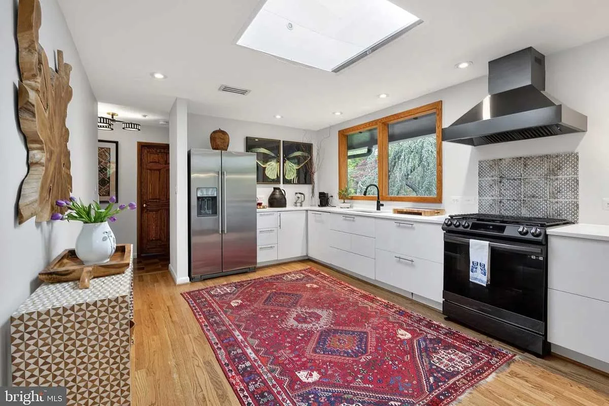kitchen with white cabinetry and stainless steel appliances