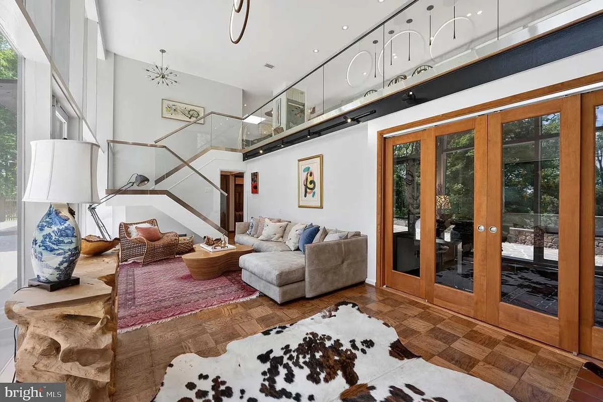 staircase that leads down to lower level living room