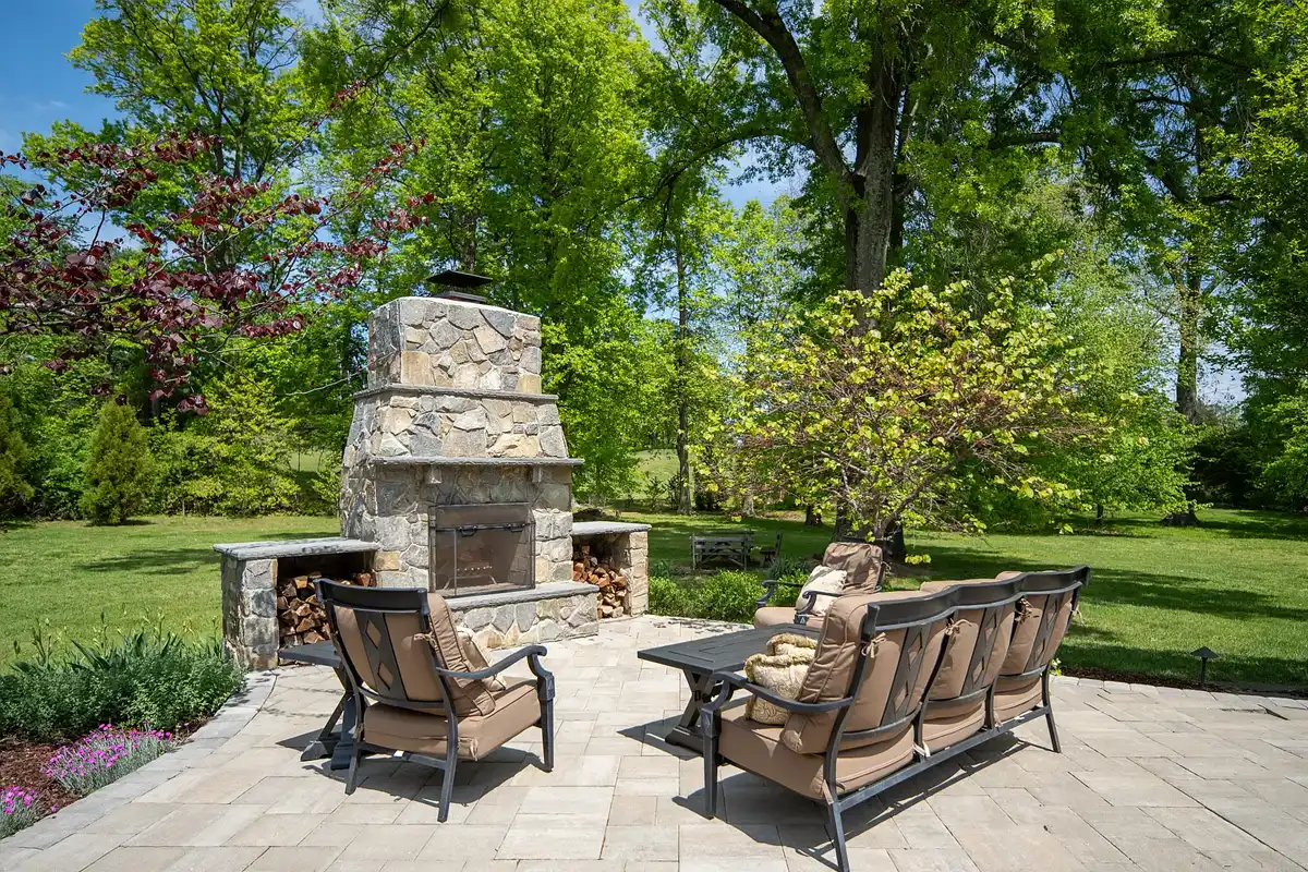 back patio with outdoor fireplace and sitting area