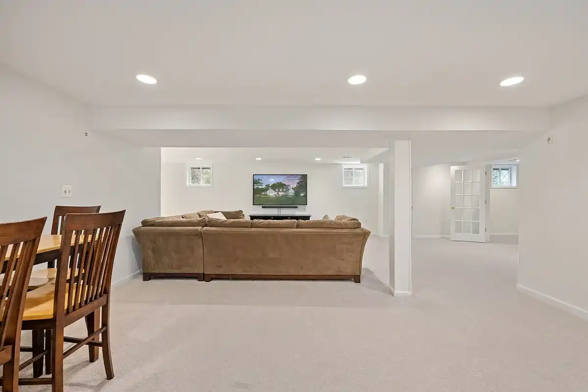 finished lower level with sofa and TV