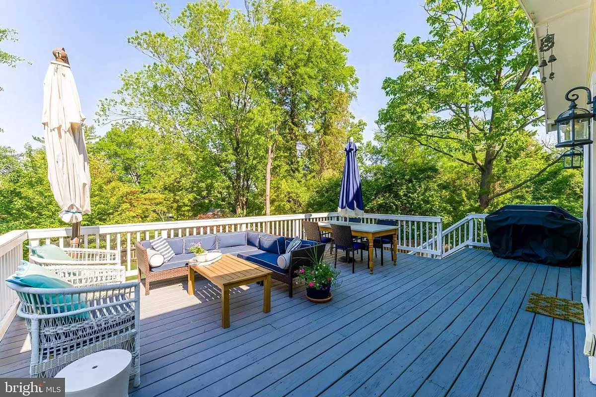 back porch with outdoor seating and grill