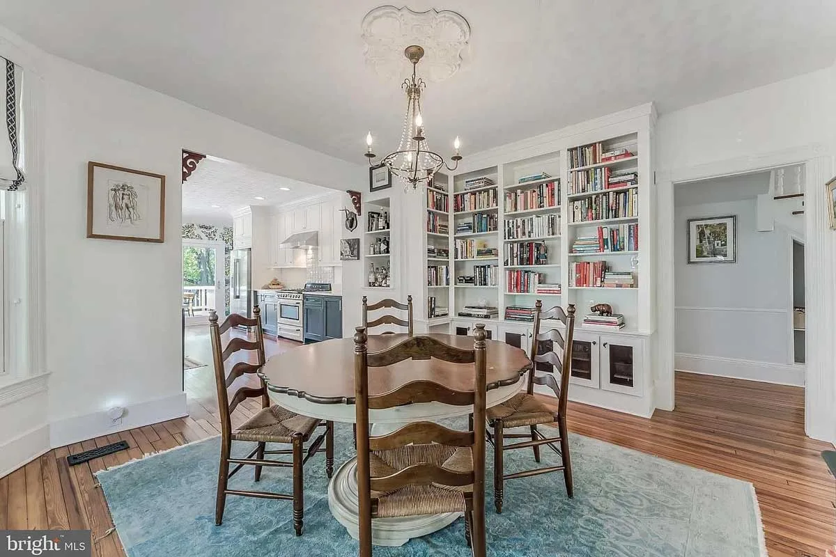 dining room with circular table and built-in shelves
