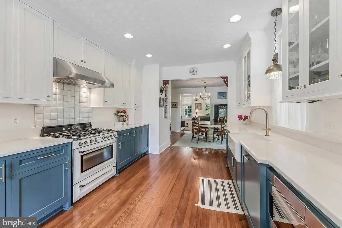 kitchen with two-tone cabinets (white and blue)
