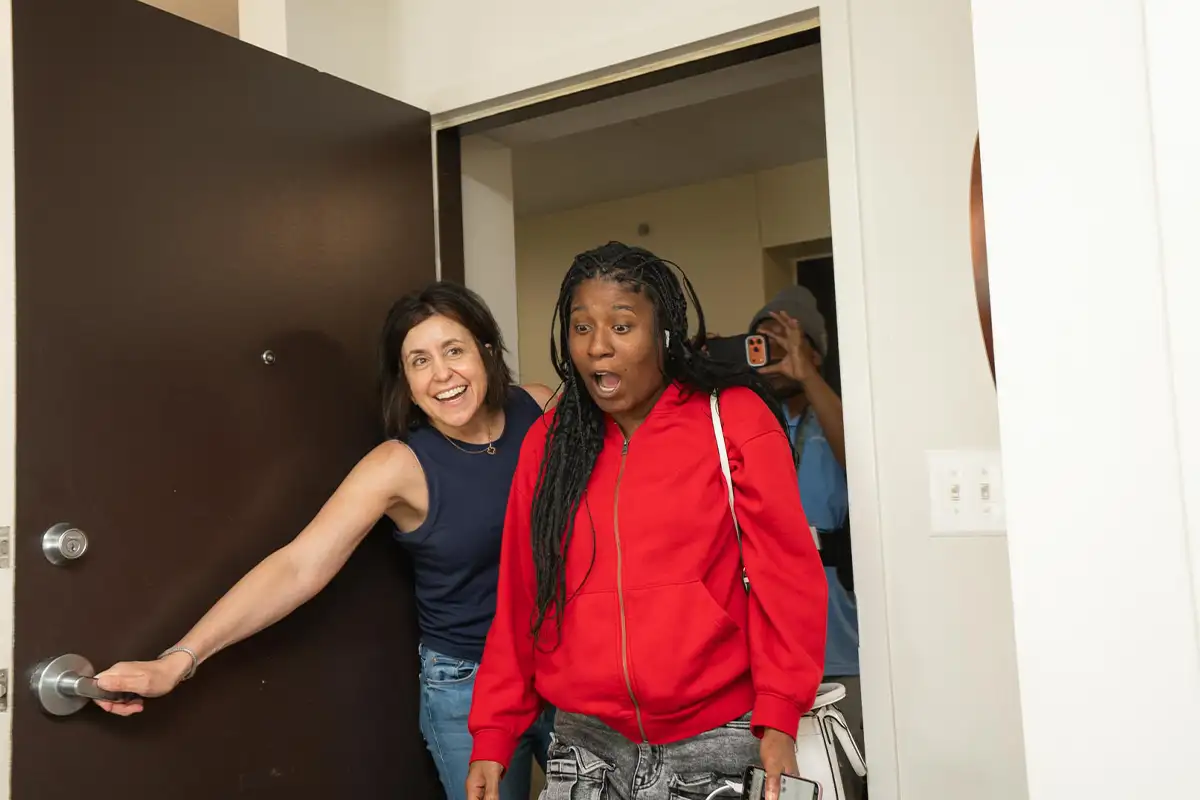 A recipient of a home makeover sees her apartment