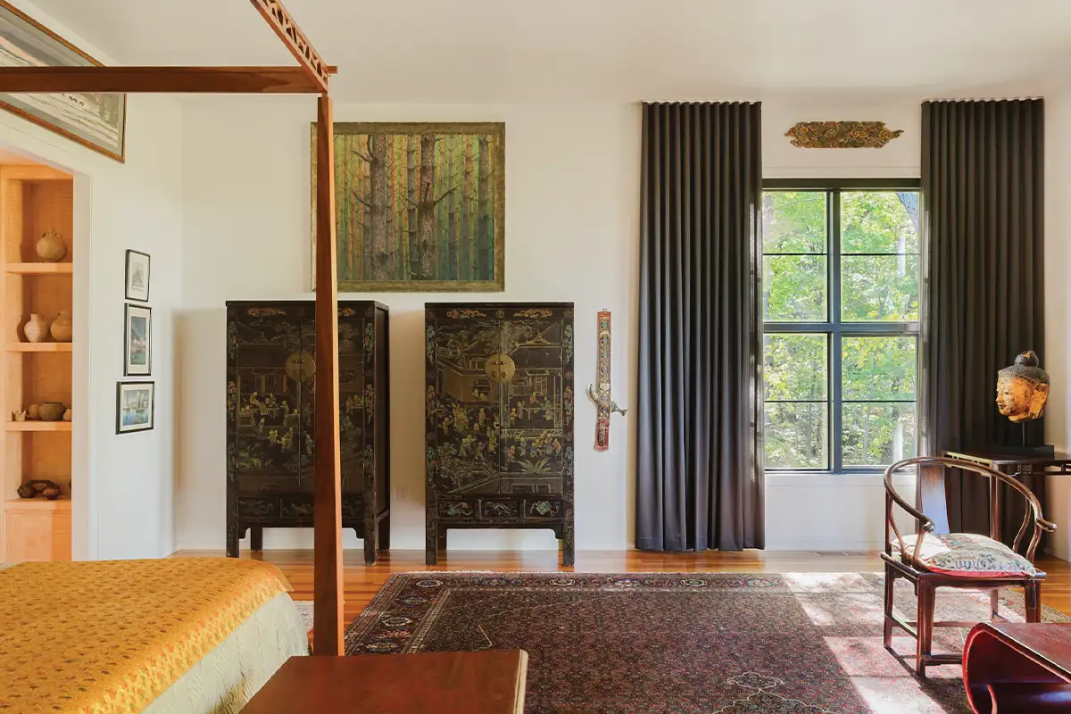 Room with antique cabinets and knife hanging on wall