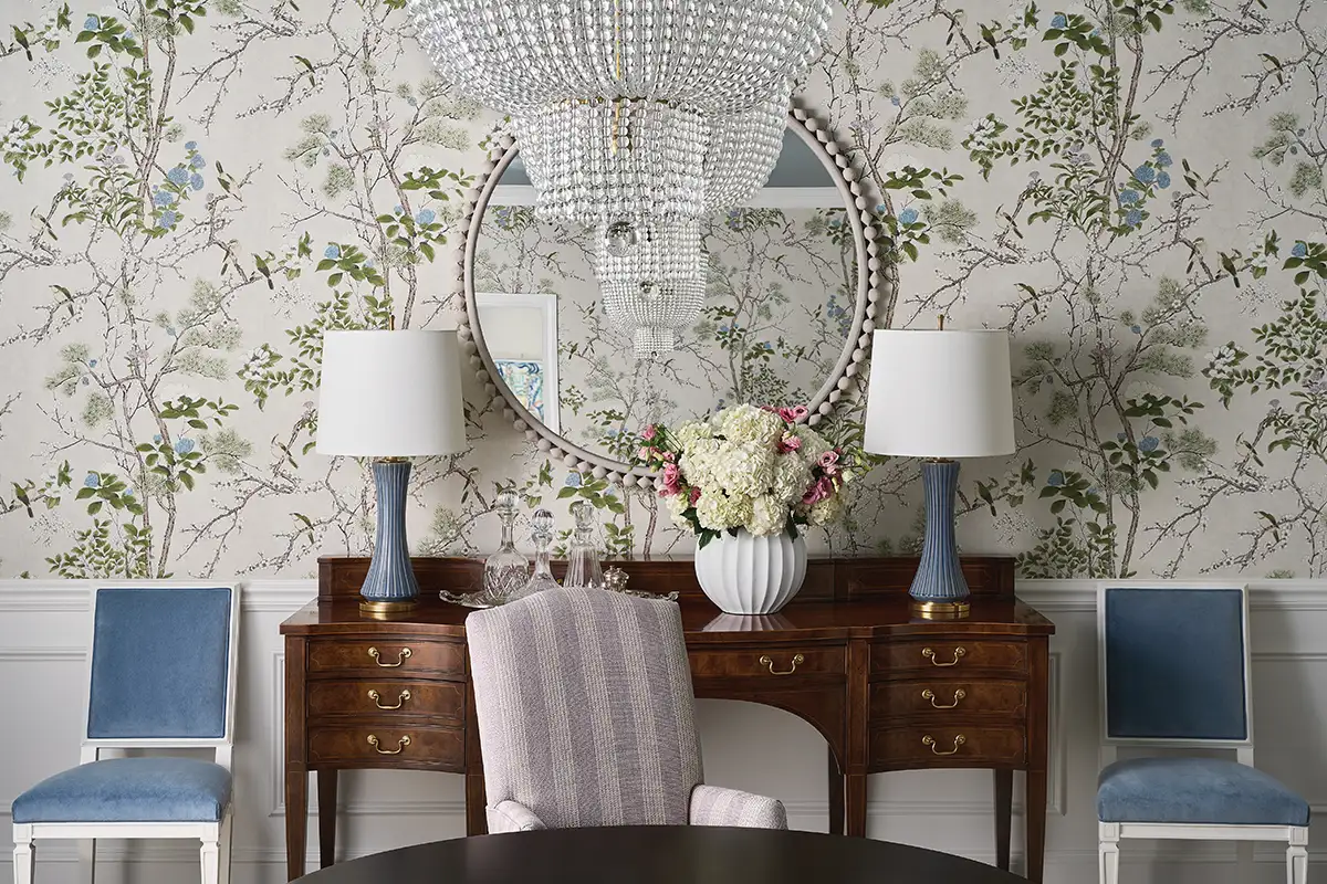 Room with floral wallpaper and antique furniture