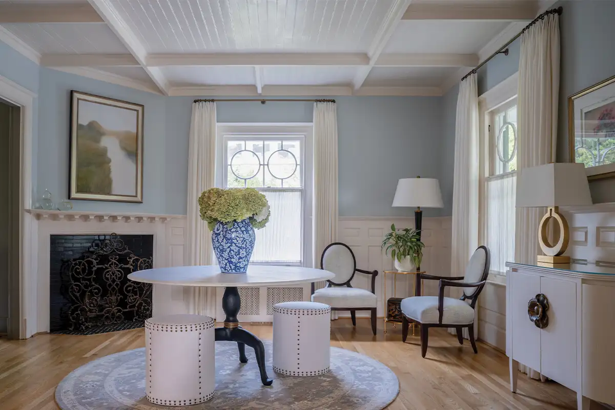 Entryway with light blue walls and antique accents
